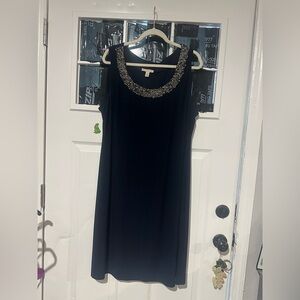 Elegant Black Mini Dress with Embellished Neckline